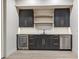 Modern basement bar with sleek cabinets, a wine fridge, and ample counter space for entertaining at 14545 Lipan St, Westminster, CO 80023
