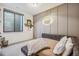 Cozy bedroom features a unique football neon sign and comfortable furnishings, creating a fun space at 14545 Lipan St, Westminster, CO 80023