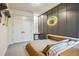 Well-lit bedroom boasts modern decor and ample storage, creating a comfortable and inviting space at 14545 Lipan St, Westminster, CO 80023