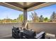 Relax on this inviting covered patio with comfortable seating, offering a serene outdoor retreat at 14545 Lipan St, Westminster, CO 80023