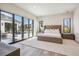 A spacious main bedroom features large sliding glass doors leading to an outdoor patio and pool area at 14545 Lipan St, Westminster, CO 80023