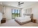 Main bedroom featuring a large sliding glass door with views to a green space at 14545 Lipan St, Westminster, CO 80023