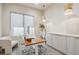 A bright office with a light color scheme, a wooden desk, and built-in storage solutions offers a modern workspace at 14545 Lipan St, Westminster, CO 80023