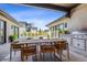 Stylish outdoor dining area with a grill and a view, perfect for entertaining by the pool at 14545 Lipan St, Westminster, CO 80023