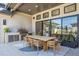 Covered outdoor dining area with a grill and seating, ideal for alfresco meals and entertaining at 14545 Lipan St, Westminster, CO 80023