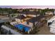 Aerial view featuring a luxurious backyard with a sparkling pool, patio, and fire pit area at 14545 Lipan St, Westminster, CO 80023