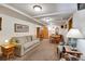 Spacious basement with a comfortable seating area and dining space with plenty of room to spread out at 1774 Upper Bear Creek Rd, Evergreen, CO 80439