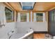 Relaxing bathroom featuring a skylight, bathtub, and multiple windows with pleasant views at 1774 Upper Bear Creek Rd, Evergreen, CO 80439