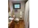 Cozy bathroom with wood accents, tiled walls, and a shower with a white curtain at 1774 Upper Bear Creek Rd, Evergreen, CO 80439