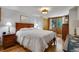 Comfortable bedroom with hardwood floors, wood accents, and neutral wall color at 1774 Upper Bear Creek Rd, Evergreen, CO 80439
