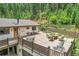 Spacious deck furnished with seating and a dining area, ideal for outdoor relaxation at 1774 Upper Bear Creek Rd, Evergreen, CO 80439
