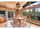 Dining area with wood accents and mountain views, perfect for gatherings at 1774 Upper Bear Creek Rd, Evergreen, CO 80439