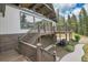 Charming home with a wooden deck, nestled among lush greenery, offering a serene retreat at 1774 Upper Bear Creek Rd, Evergreen, CO 80439