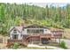 Beautiful home featuring expansive decks perfect for outdoor living and entertaining at 1774 Upper Bear Creek Rd, Evergreen, CO 80439