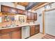 Functional kitchen with wood cabinets, stainless steel appliances, and practical layout at 1774 Upper Bear Creek Rd, Evergreen, CO 80439