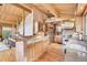 Spacious kitchen with stainless steel appliances, ample counter space and wood cabinetry at 1774 Upper Bear Creek Rd, Evergreen, CO 80439