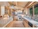 Well-equipped kitchen with stainless steel appliances and scenic views at 1774 Upper Bear Creek Rd, Evergreen, CO 80439