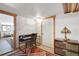Home office features a desk, a chair, lamp, and tile flooring at 1774 Upper Bear Creek Rd, Evergreen, CO 80439