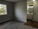 Bedroom featuring updated bathroom and a large window for plenty of natural light at 5875 E Iliff Ave # 203, Denver, CO 80222