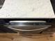 Whirlpool stainless steel dishwasher set under granite countertop at 5875 E Iliff Ave # 203, Denver, CO 80222