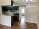 Bright kitchen features stainless steel appliances, modern lighting, and a convenient breakfast bar at 5875 E Iliff Ave # 203, Denver, CO 80222