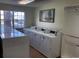The community laundry room has several new, efficient washers for resident use at 5875 E Iliff Ave # 203, Denver, CO 80222