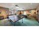 Expansive recreation room with a full-sized pool table, foosball, and table tennis for entertaining at 5875 E Iliff Ave # 203, Denver, CO 80222