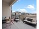 Apartment balcony with outdoor seating area at 1898 S Bannock St # 209, Denver, CO 80223