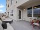 Condo balcony with cozy lounge seating and an outdoor dining set, perfect for entertaining and relaxation at 1898 S Bannock St # 209, Denver, CO 80223