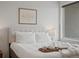 Comfortable bedroom with a large window and plush bedding at 1898 S Bannock St # 209, Denver, CO 80223