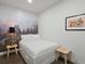 Bedroom with a modern decor and platform bed and wood floor at 1898 S Bannock St # 209, Denver, CO 80223
