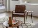 Staged living room with modern furniture and decor and wood floor at 1898 S Bannock St # 209, Denver, CO 80223