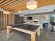Chic recreation room with a ping pong table, fireplace, and comfortable seating, creating a vibrant social atmosphere at 1898 S Bannock St # 209, Denver, CO 80223