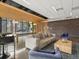 Beautiful lounge featuring modern decor, a ping pong table, and comfortable seating arrangements at 1898 S Bannock St # 209, Denver, CO 80223