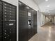 Close-up of apartment complex mailboxes located inside a wide interior hallway at 1898 S Bannock St # 209, Denver, CO 80223