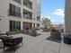 Well-maintained condo patio with seating area and lush landscaping for an inviting outdoor experience at 1898 S Bannock St # 209, Denver, CO 80223