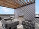 Stylish rooftop patio with a fireplace, ample seating, and stunning panoramic views, perfect for entertaining at 1898 S Bannock St # 209, Denver, CO 80223
