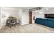Finished basement area with carpeted floors, plenty of space and additional seating at 706 S Lincoln St, Denver, CO 80209