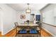 Dining room area with hardwood floors, stylish light fixture, and plenty of natural light at 706 S Lincoln St, Denver, CO 80209