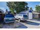 Garage and parking area with an adjacent detached garage and space for multiple vehicles at 706 S Lincoln St, Denver, CO 80209
