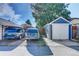 Exterior shot showing a detached one-car garage alongside other parking spaces in the rear of the property at 706 S Lincoln St, Denver, CO 80209