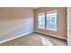Bright and airy bedroom with neutral walls, carpeted floors, and natural light at 8537 E 35Th Ave, Denver, CO 80238