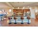 Modern kitchen with a large center island, stainless steel appliances, and stylish barstool seating at 8537 E 35Th Ave, Denver, CO 80238