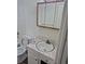 Updated bathroom featuring subway tile, toilet, sink, and a mirror at 4678 S Lewiston Way, Aurora, CO 80015