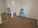 Bedroom with a mirrored closet, ladder, and a to-do list written on the mirror at 4678 S Lewiston Way, Aurora, CO 80015