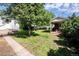 Beautiful backyard featuring a covered patio with a brick fireplace, perfect for outdoor gatherings at 505 Maple St, Golden, CO 80403