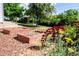 Landscaped backyard with raised garden beds and colorful flowers, creating a serene outdoor space at 505 Maple St, Golden, CO 80403