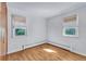 Cozy bedroom features hardwood flooring, a window, and a built in closet, with simple interior design at 505 Maple St, Golden, CO 80403