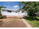 Charming home exterior with a walkway leading to the entrance and flowerbeds at 505 Maple St, Golden, CO 80403