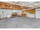 Functional garage space with ample storage, workbench, and room for projects and parking at 505 Maple St, Golden, CO 80403